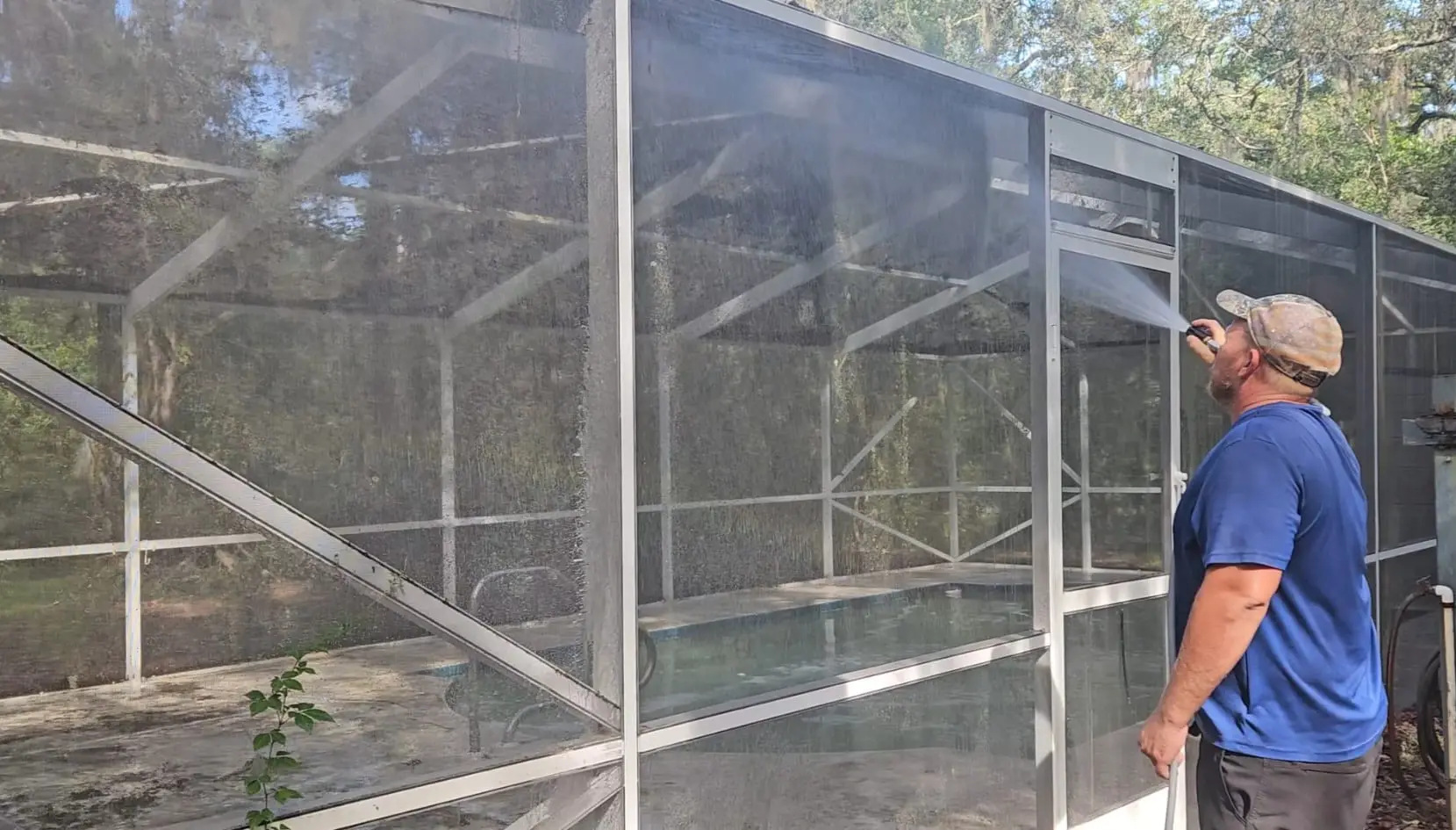 Professional pool cage cleaning service removing mold and algae buildup